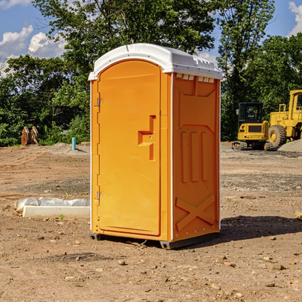 what is the cost difference between standard and deluxe portable restroom rentals in Sanders